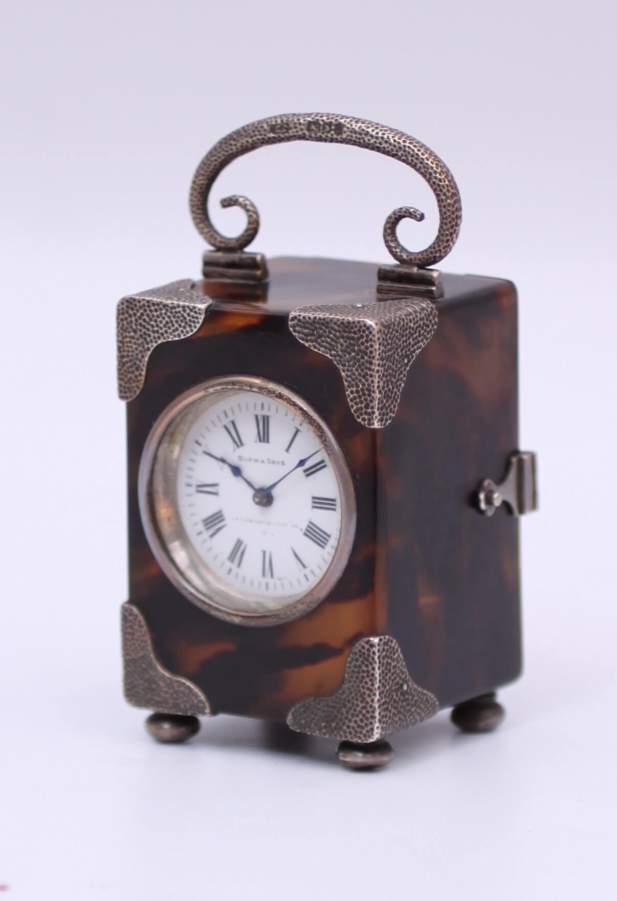 English tortoiseshell miniature silver carriage clock
