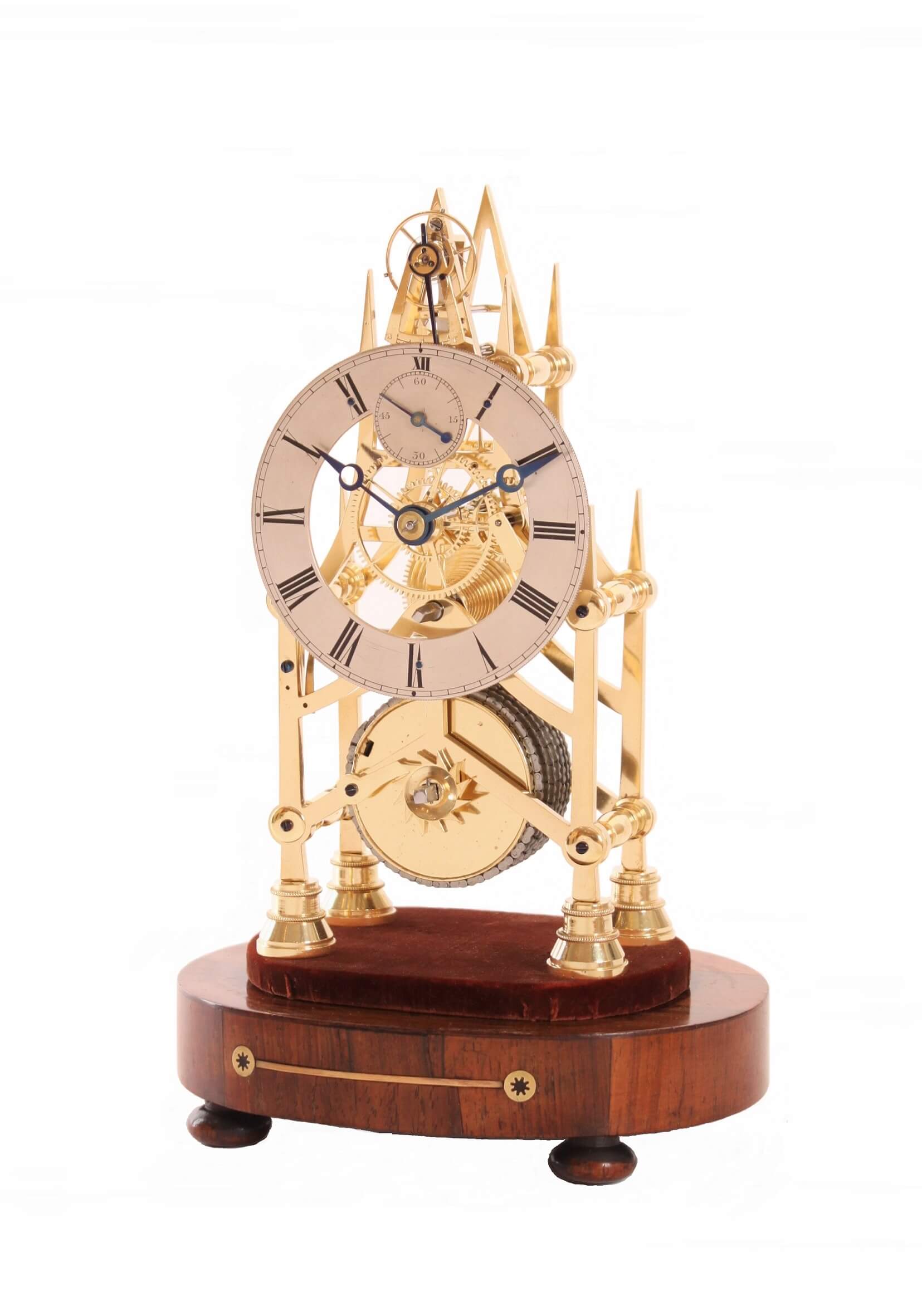 A large English Neo Gothic brass quarter chiming skeleton clock, circa  1850. - Gude & Meis