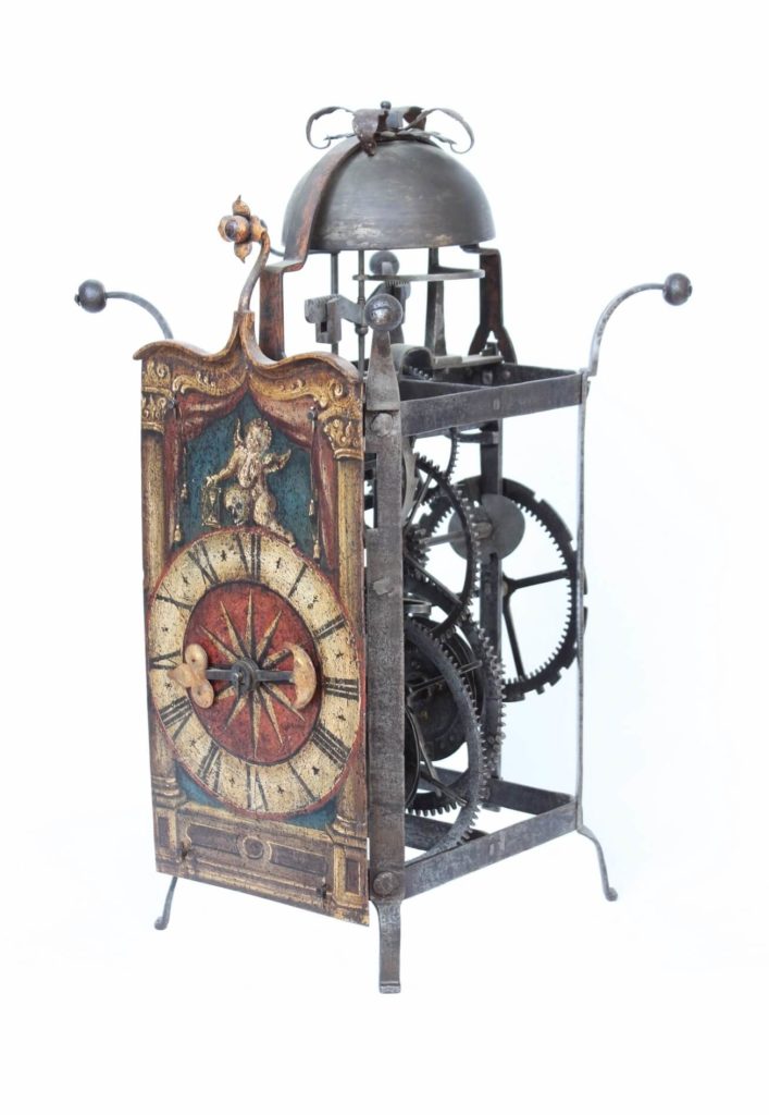 A large South German gothic polychrome painted iron wall clock, circa