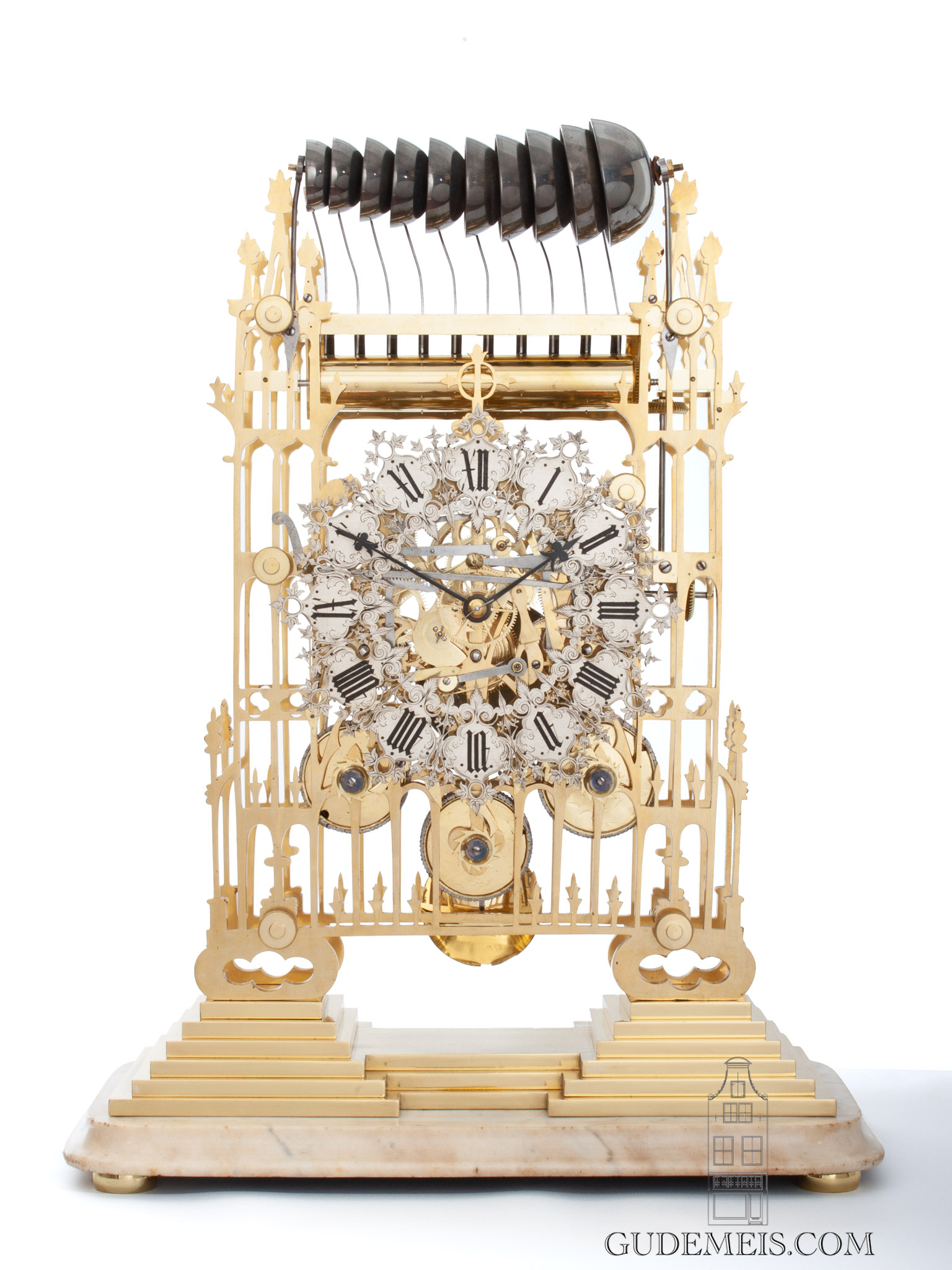 A large English Neo Gothic brass quarter chiming skeleton clock, circa  1850. - Gude & Meis