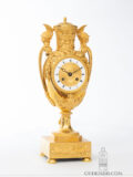 French-Empire-ormolu-gilt-bronze-striking-antique-urn-mantel-clock-aux Tetes-de-guerriers-