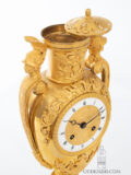 French-Empire-ormolu-gilt-bronze-striking-antique-urn-mantel-clock-aux Tetes-de-guerriers-